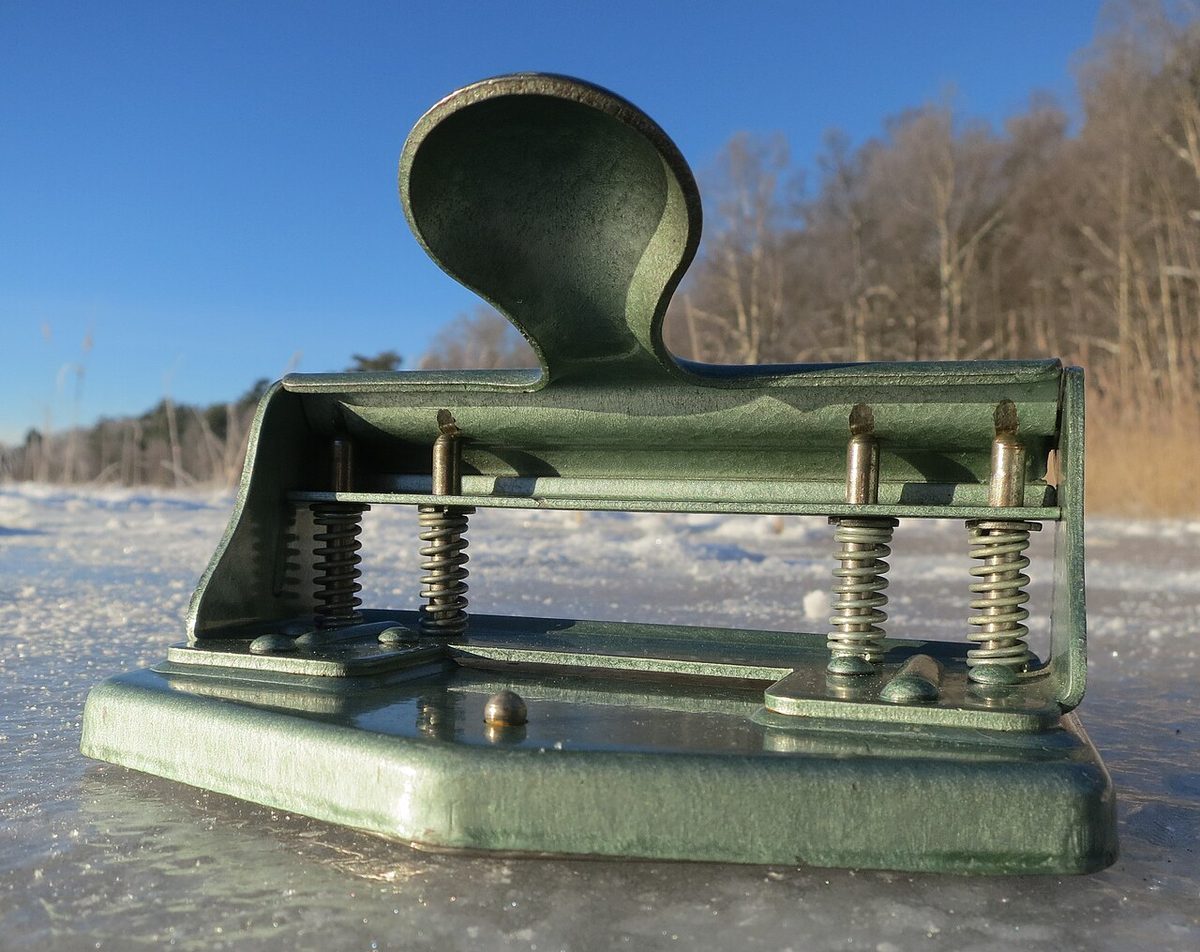 A four-hole paper punch made by Ojop in Eskilstuna, Sweden, in the 1960s. Newer than the one in the story.