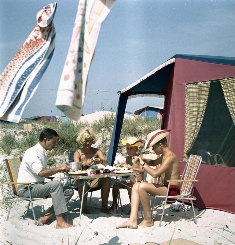 Campers eating at a folding table on the Baltic coast in 1970. Not the table in the story.