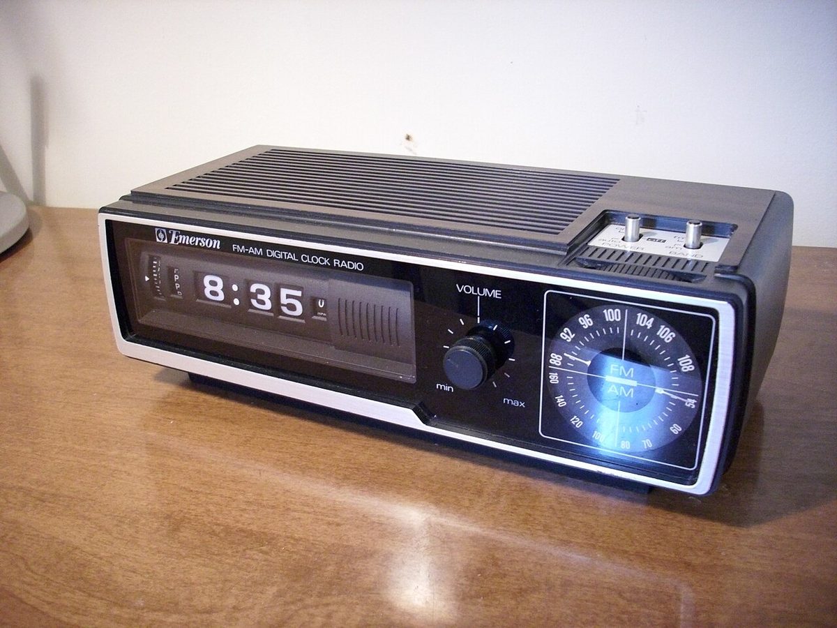 An Emerson flip-number alarm clock radio, a style common in the 1970s. Not the one in the story.