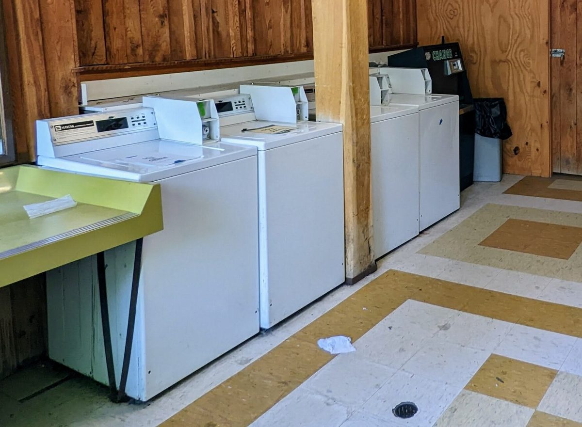 A row of coin-operated Maytag top-loading washers in a resort laundry room in Pennsylvania. Not the one in the story.